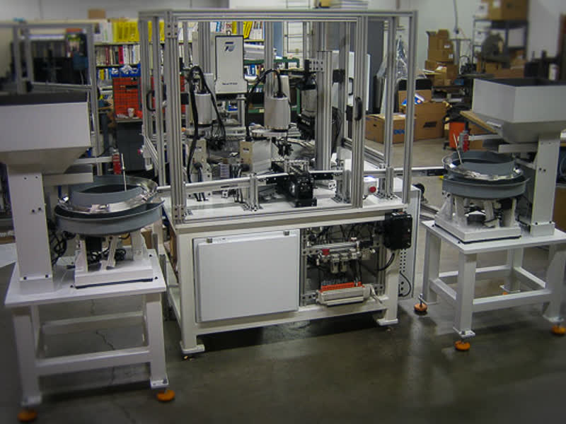 Medical switch assembly system with two vibratory feeder bowls