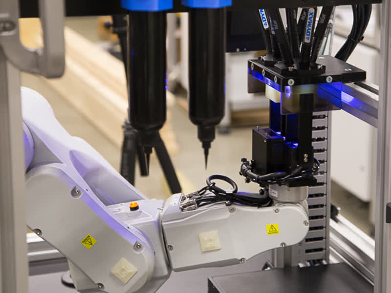 Six-axis robot dispensing adhesive