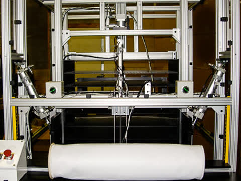 Packaging machinery for folding and packing filters into cardboard boxes